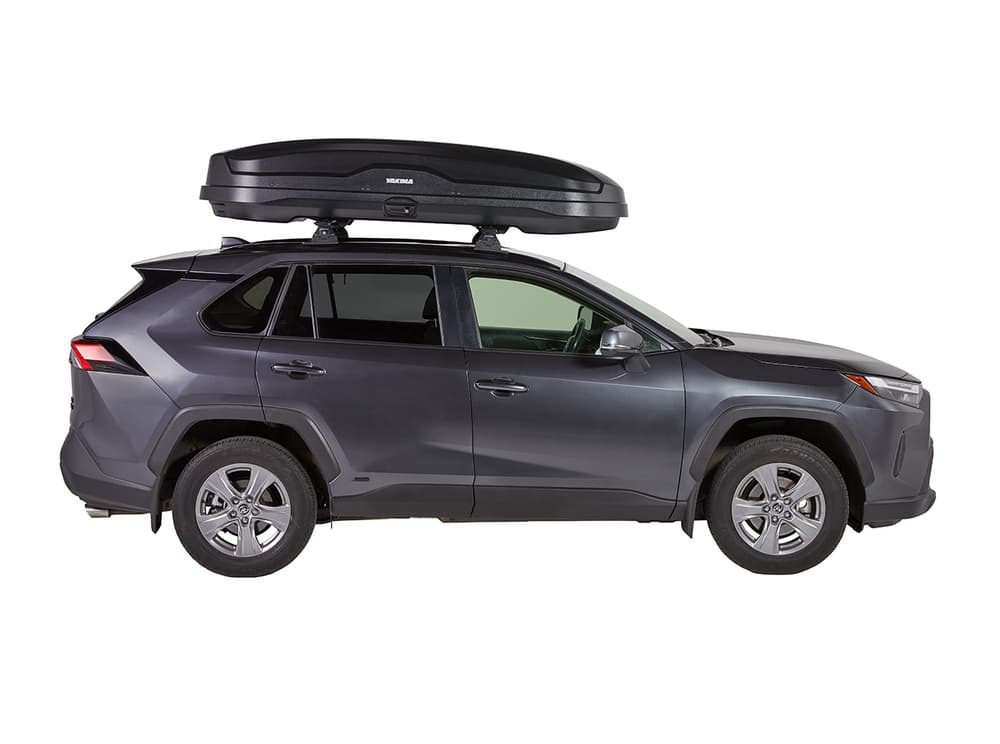 side view of Yakima NX XXL cargo box installed on suv on white background
